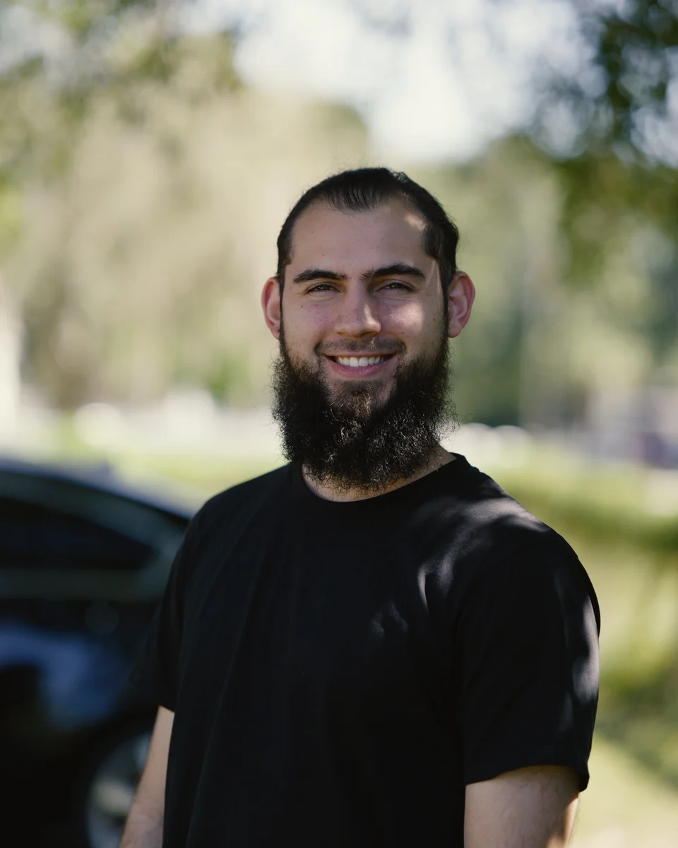 Ayoub Abedrabbo smiling outdoors