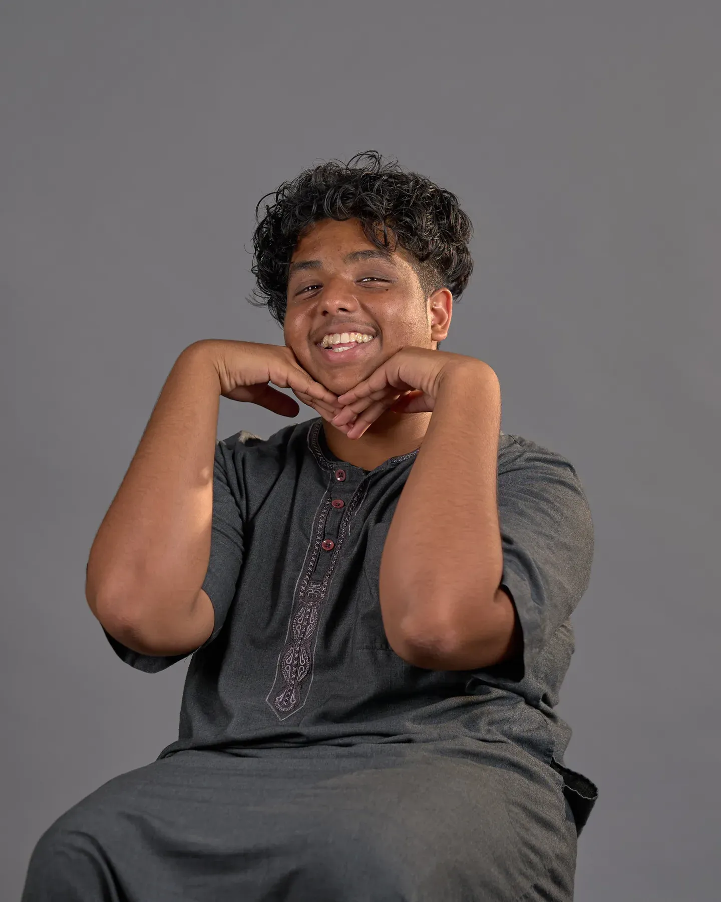 Bayaan Academy student smiling for a yearbook portrait