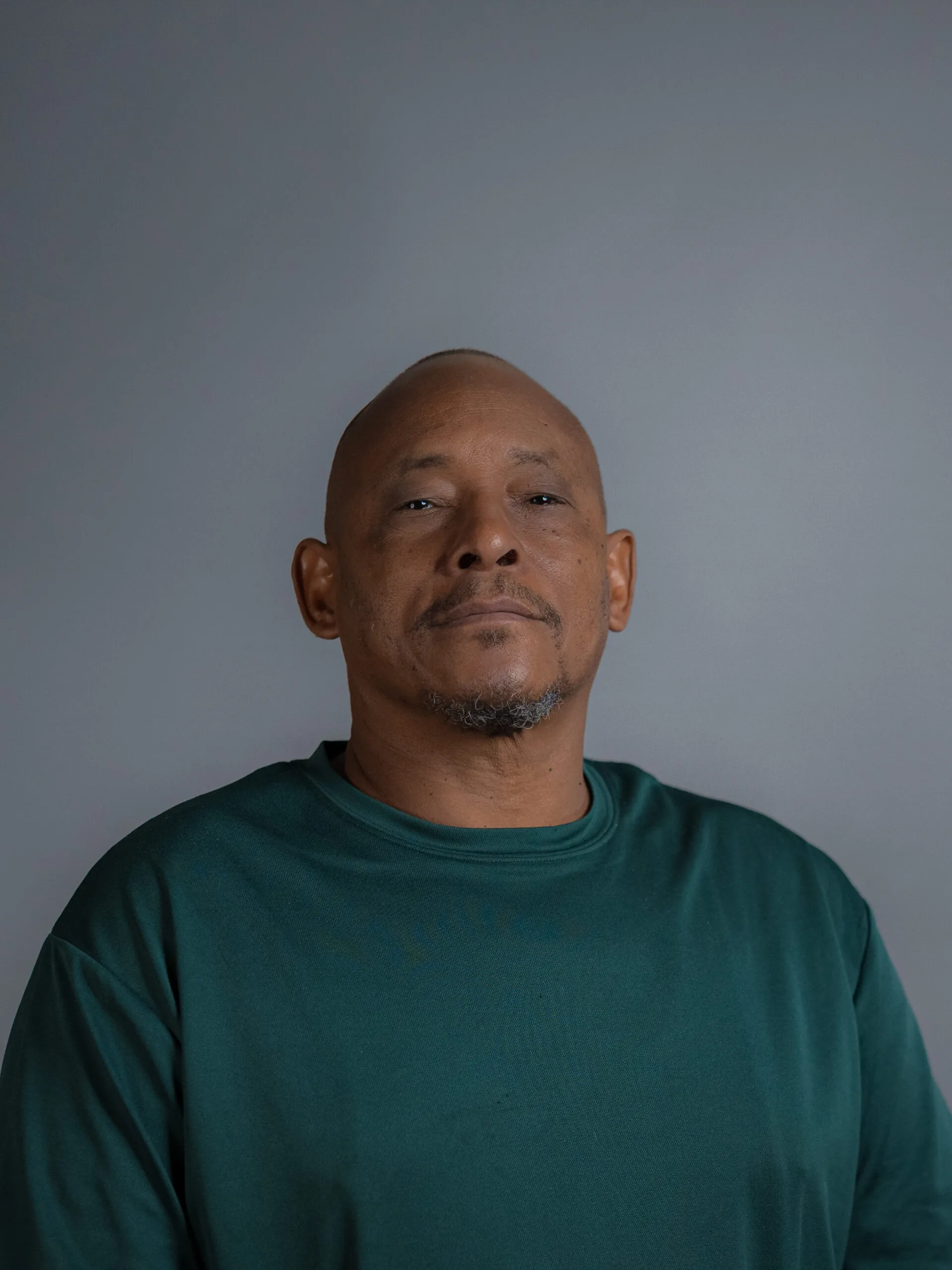 Professional headshot of Akbar Burden for Arqam Academy