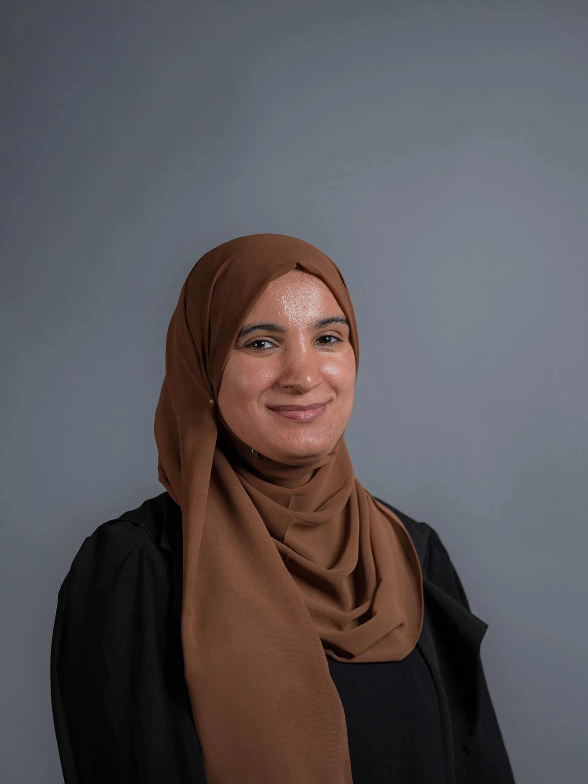 Professional headshot of Nadia Bouzeguia for Arqam Academy