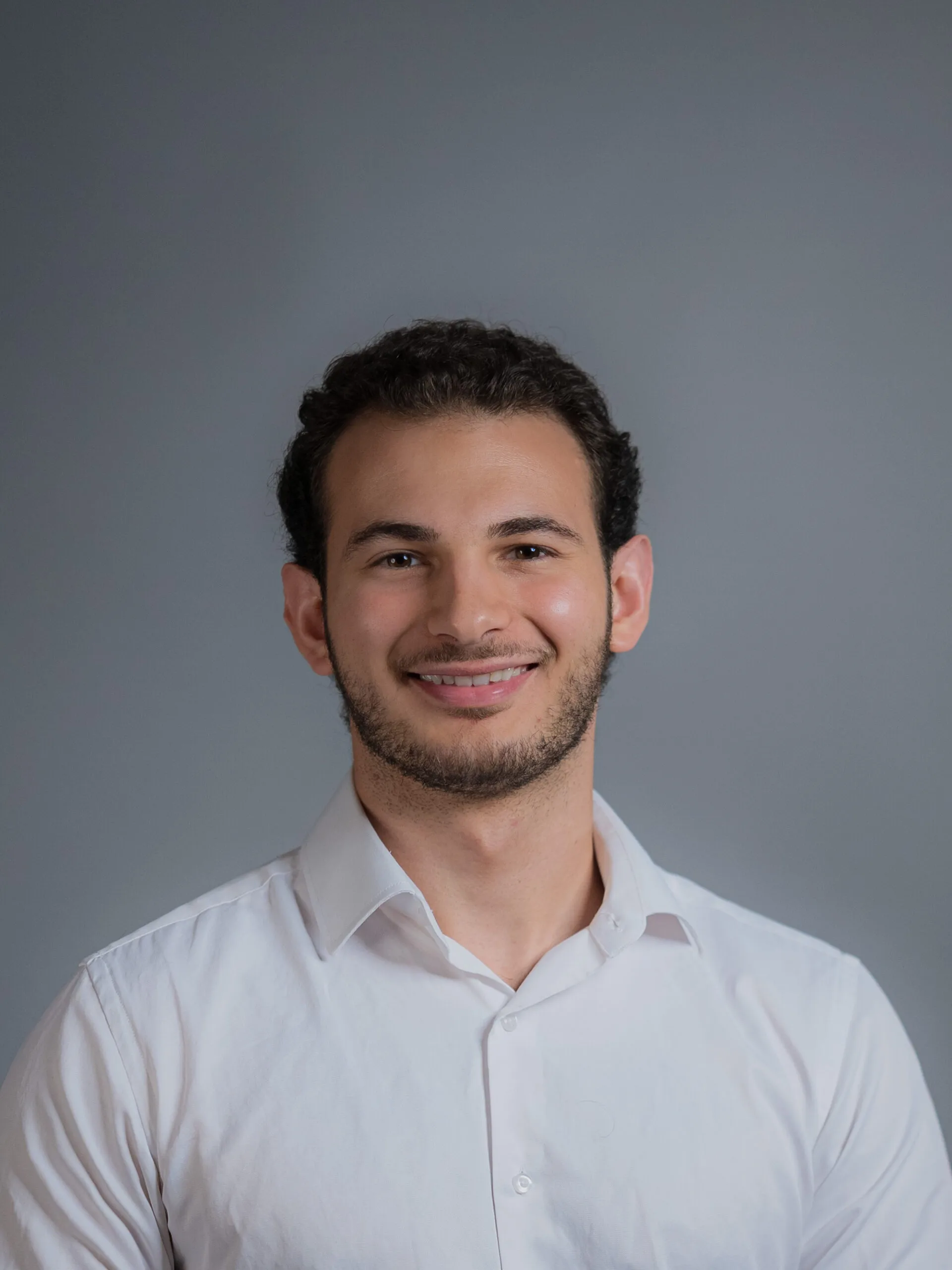 Professional headshot of Omar Sanhaji for Arqam Academy