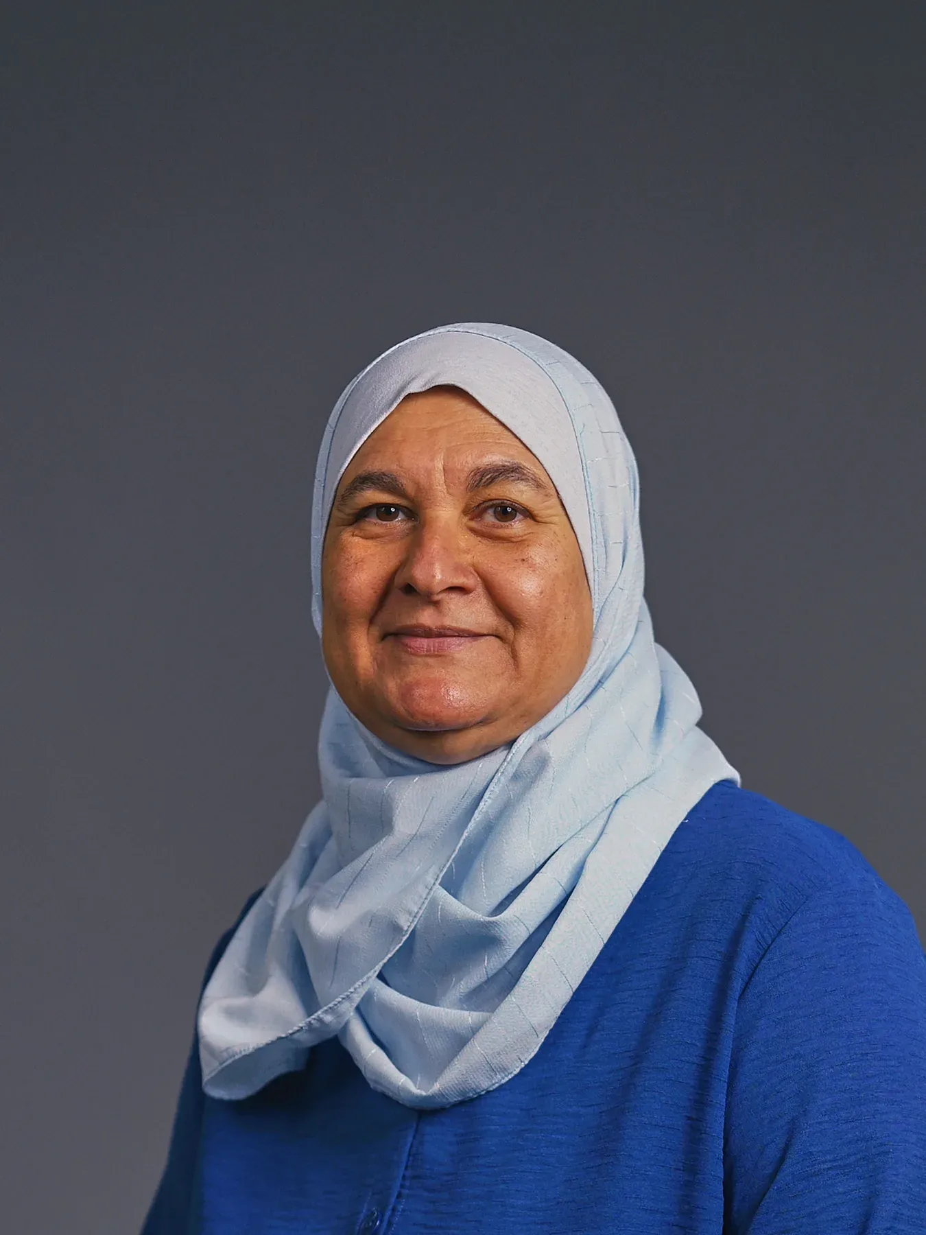 Bayaan Academy staff member wearing a light blue hijab
