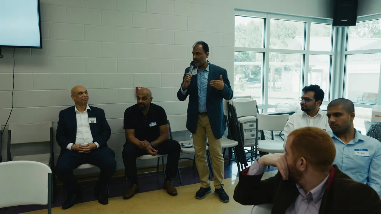 A presenter speaking to attendees during the Muslim Chamber of Commerce USA AI workshop